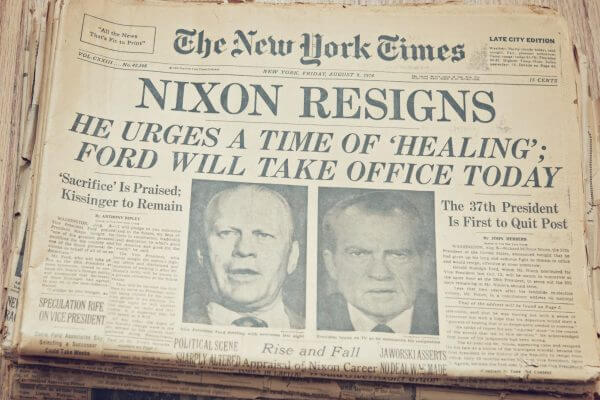 Newspaper from The New York Times on August 9, 1974. The headline reads "Nixon Resigns" followed by "he urges a time of healing; Ford will take office today."